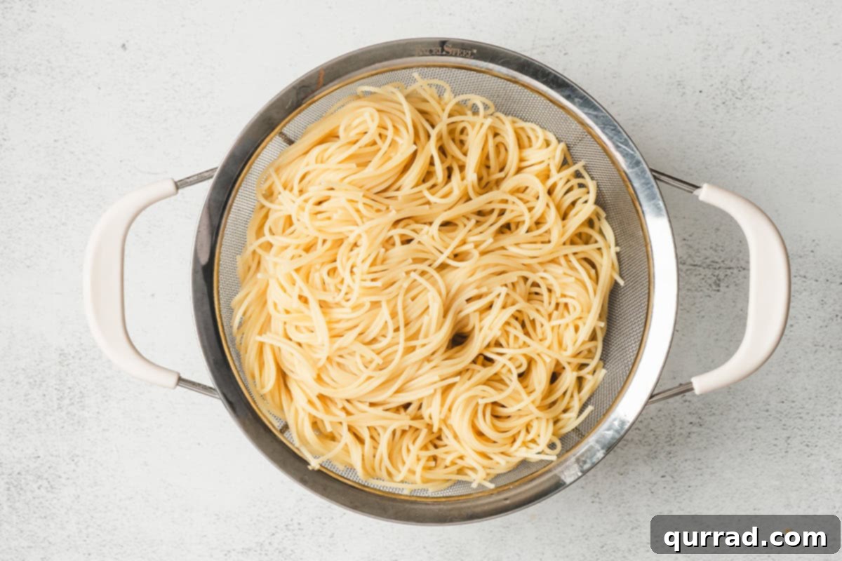 Rustic Tetrazzini 5 A large pot of thin spaghetti cooking in boiling water.