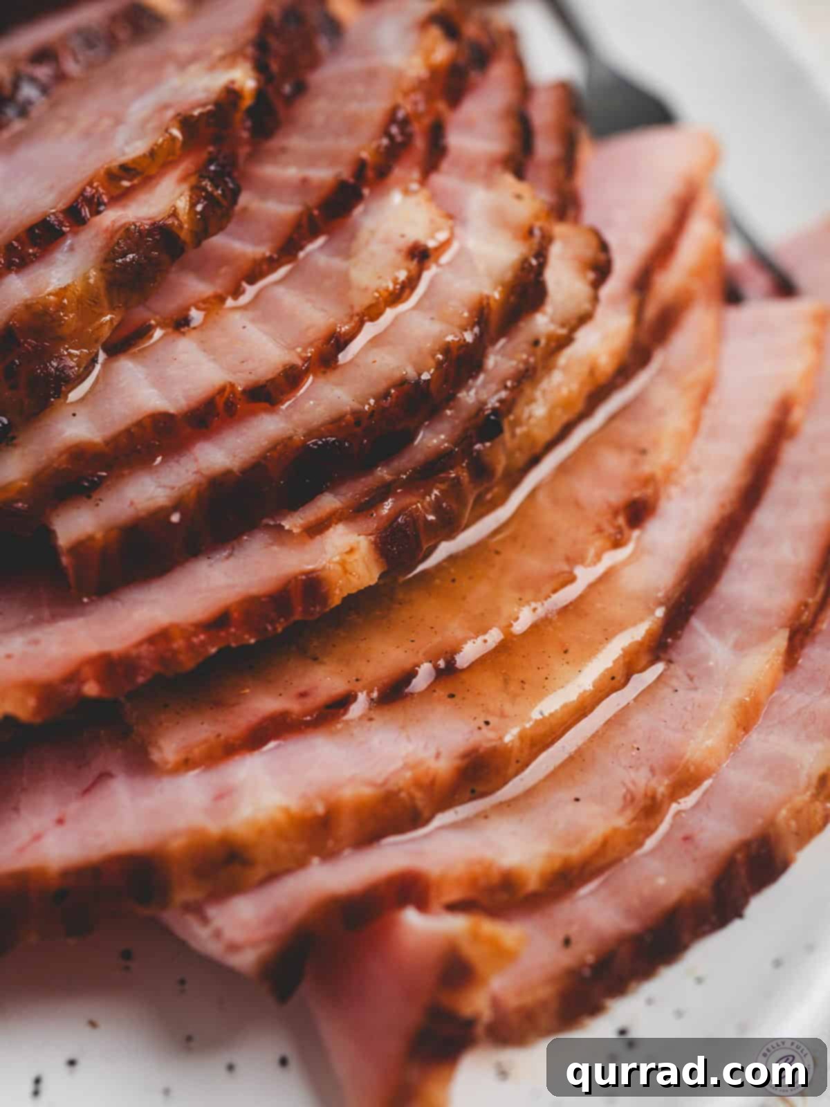 Sun-Kissed Pineapple Ham Glaze 2 A baked ham covered in pineapple ham glaze.
