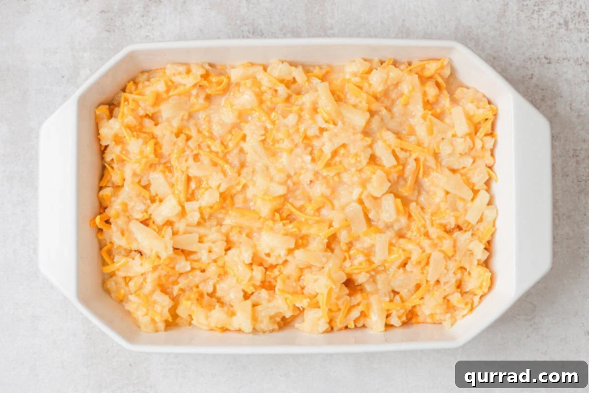 Homemade pineapple casserole filling in a baking dish.