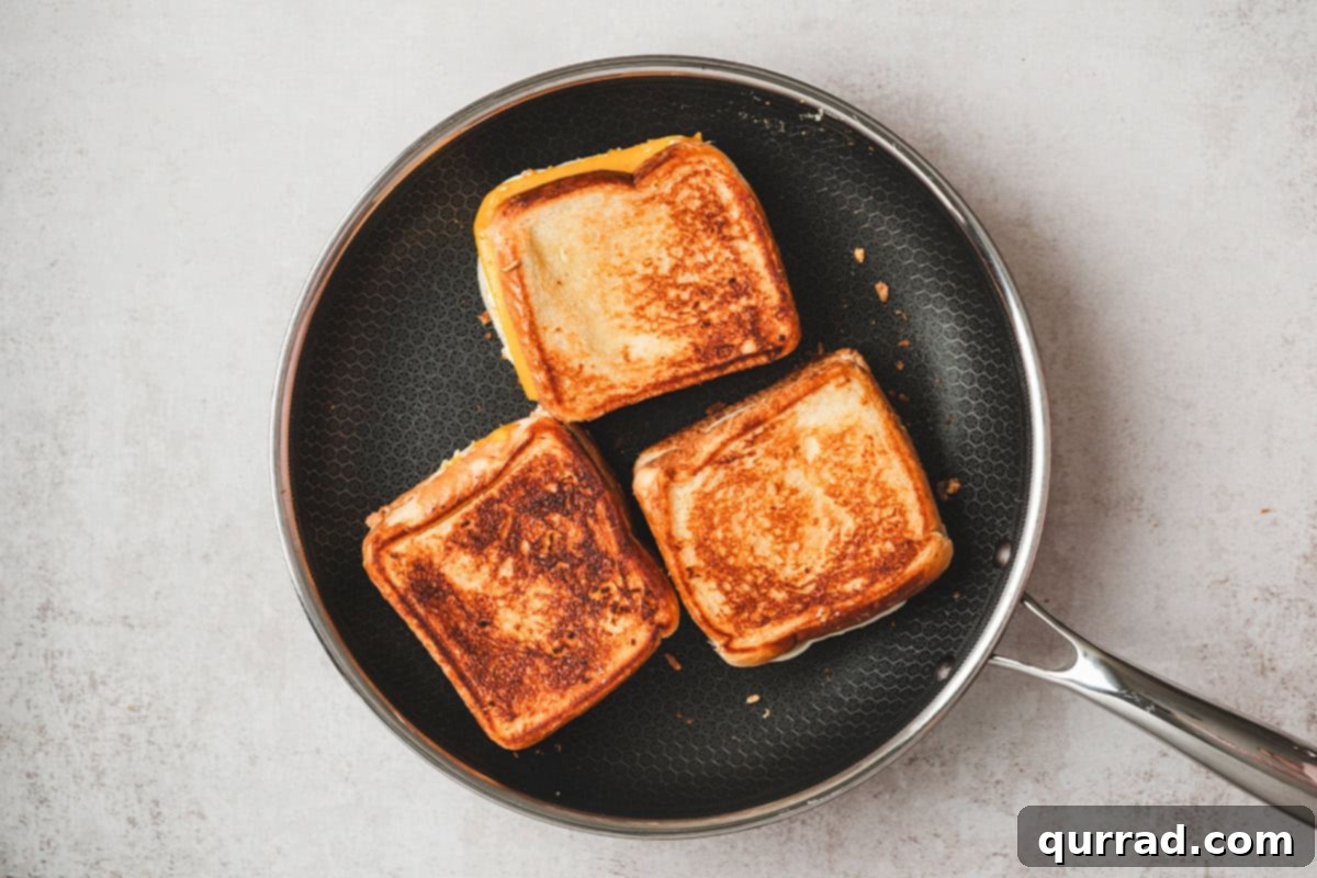 The Happiest Grilled Cheese on Earth 9 Three Disneyland copycat grilled cheese sandwiches on a plate.