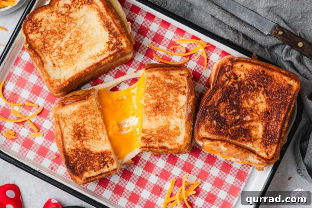 The Happiest Grilled Cheese on Earth 10 Overhead view of three Disneyland copycat grilled cheese sandwiches.