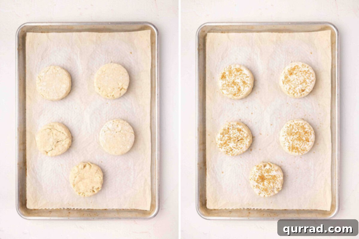 Sweet Berry Delights 9 Shaped strawberry shortcake dough on a baking sheet, followed by the dough topped with demerara sugar.