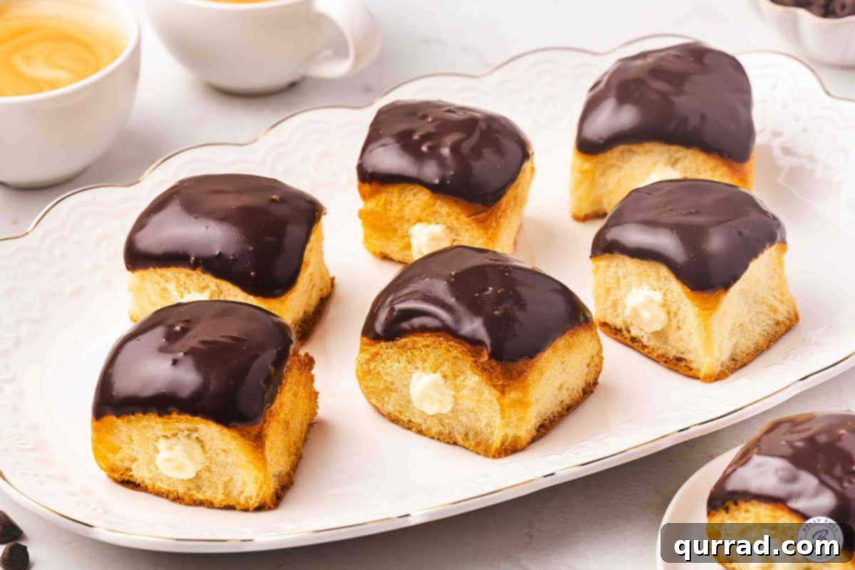 Boston Cream Pie Swirl Donuts 11 Side view of Boston cream roll pie 'donuts' arranged elegantly on a platter, ready to be served.