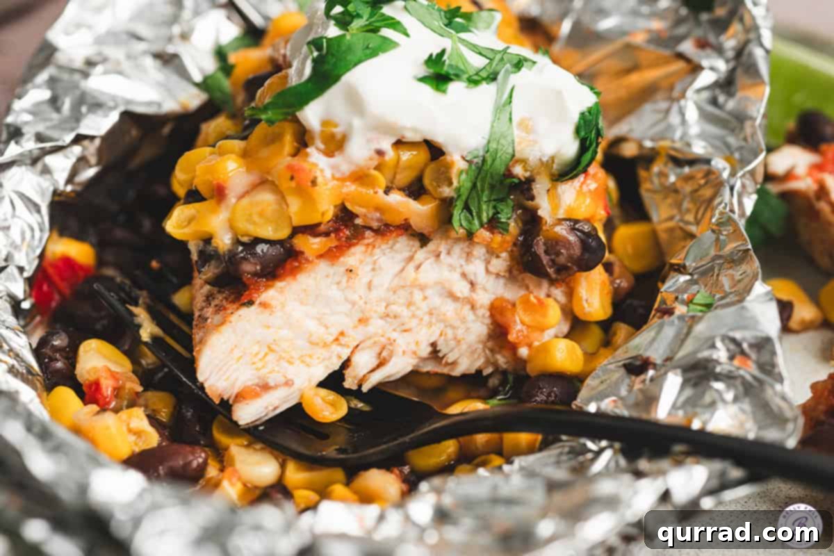 A close-up view of a fully dressed Southwestern Chicken Foil Packet, highlighting its delicious layers.