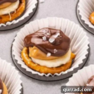 Side view of chocolate pretzel banana bites, showing the layers of pretzel, banana, peanut butter, and chocolate.