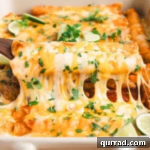 A spatula lifting lazy enchiladas out of a baking dish, ready to be served.