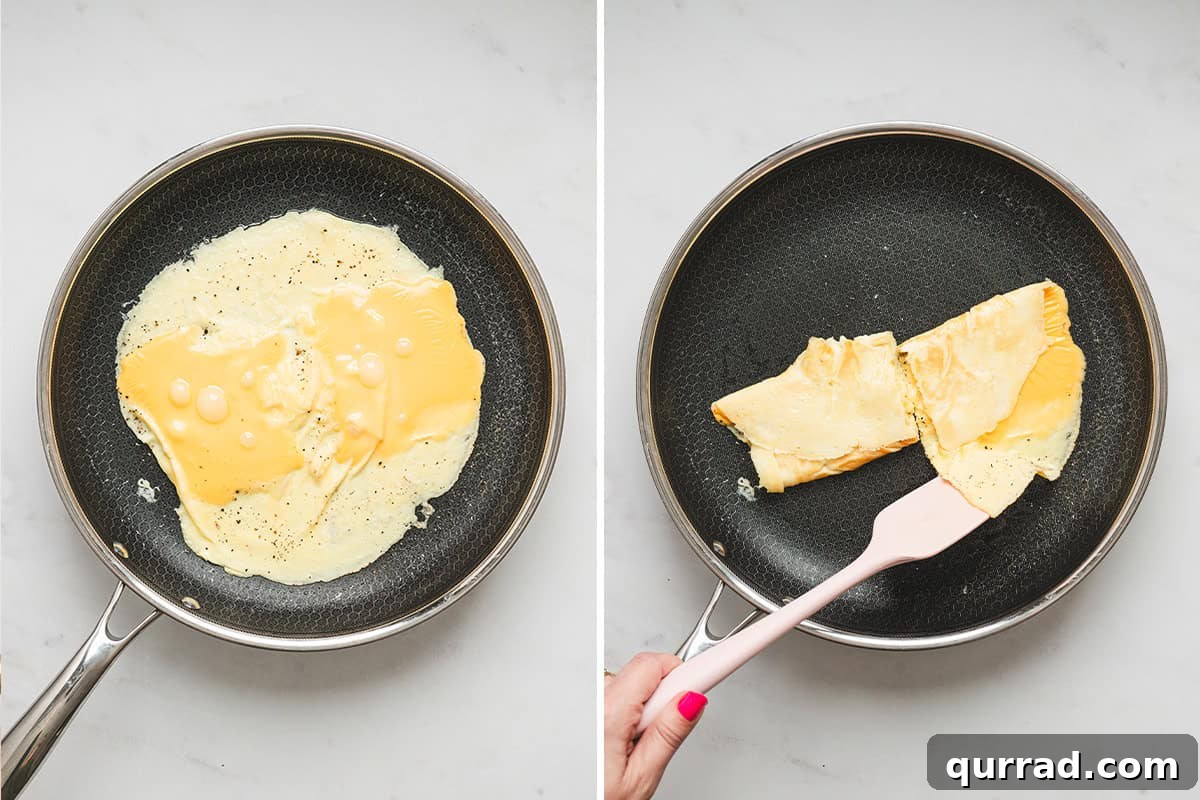 American cheese slices melting over cooked eggs in a skillet