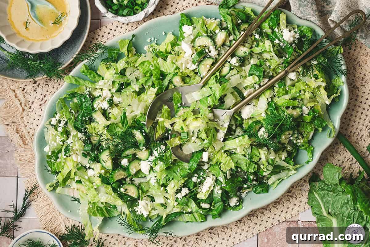 Overhead view of maroulosalata salad on a platter.