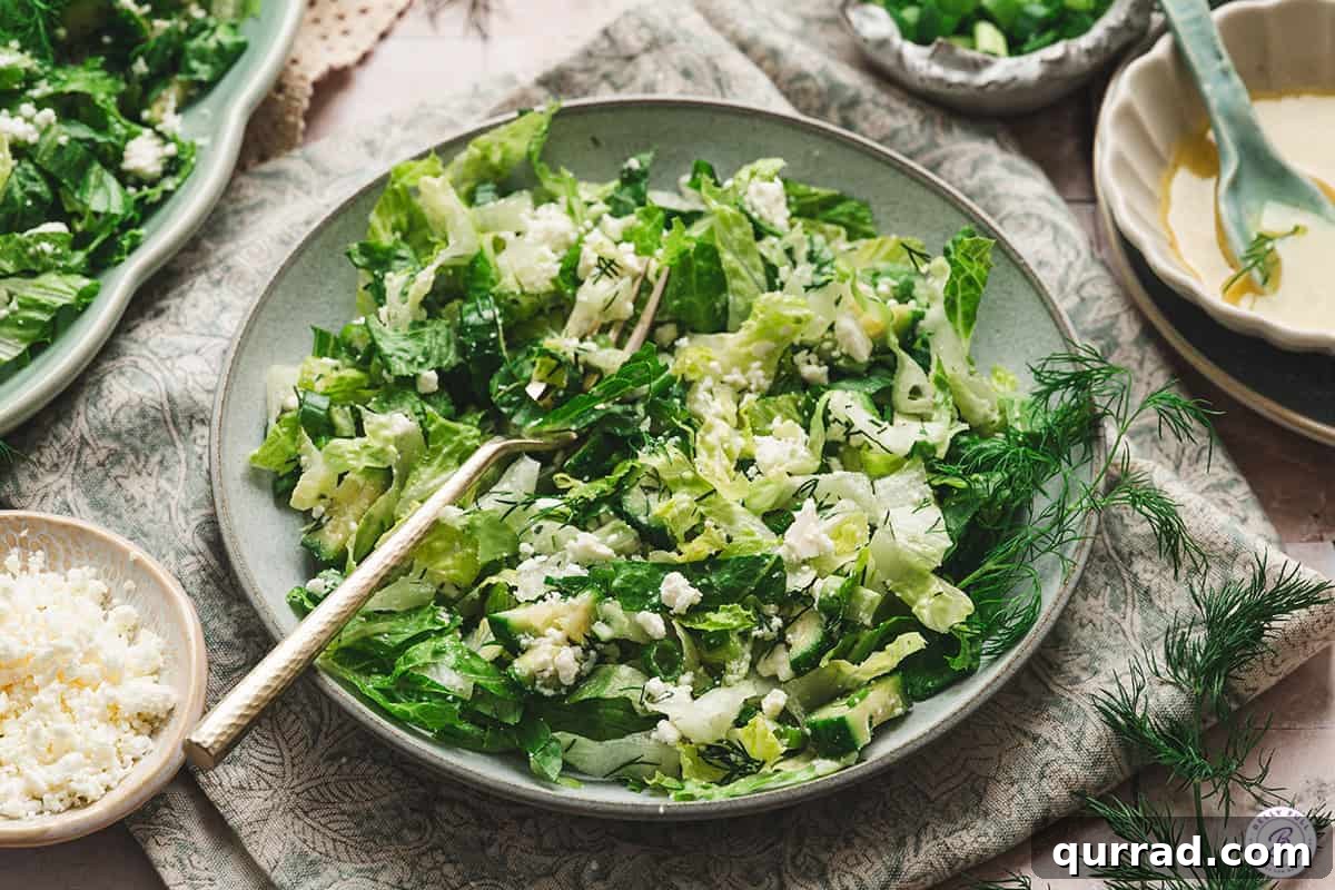 A bowl of maroulosalata with a fork.