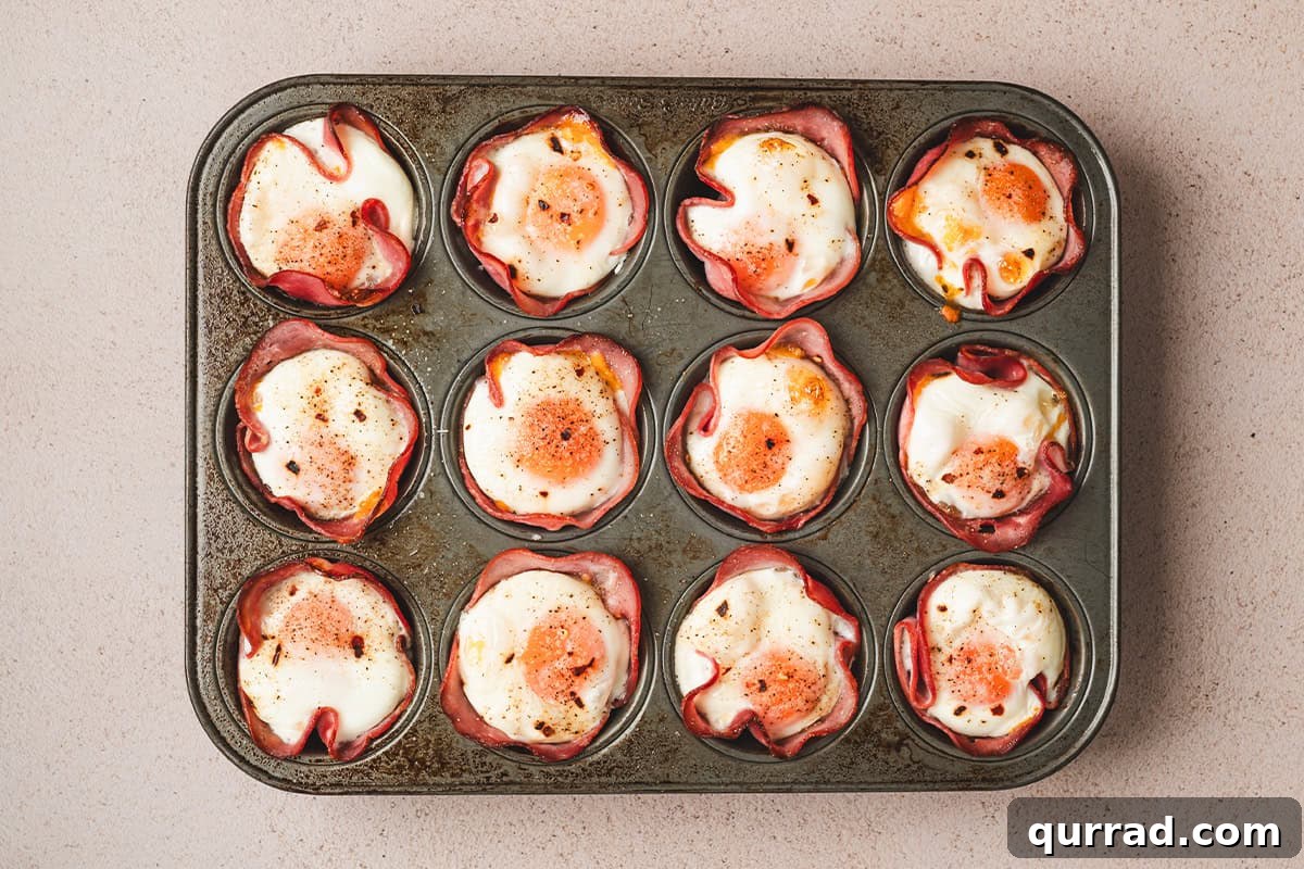 Savory Ham & Cheese Egg Cups for Quick Breakfast or Brunch 8 Ham and cheese egg cups after baking.
