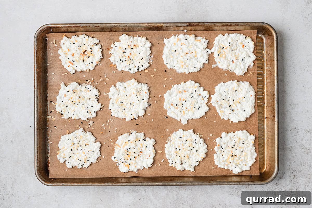 Overhead view of cottage cheese rounds topped with everything bagel seasoning.