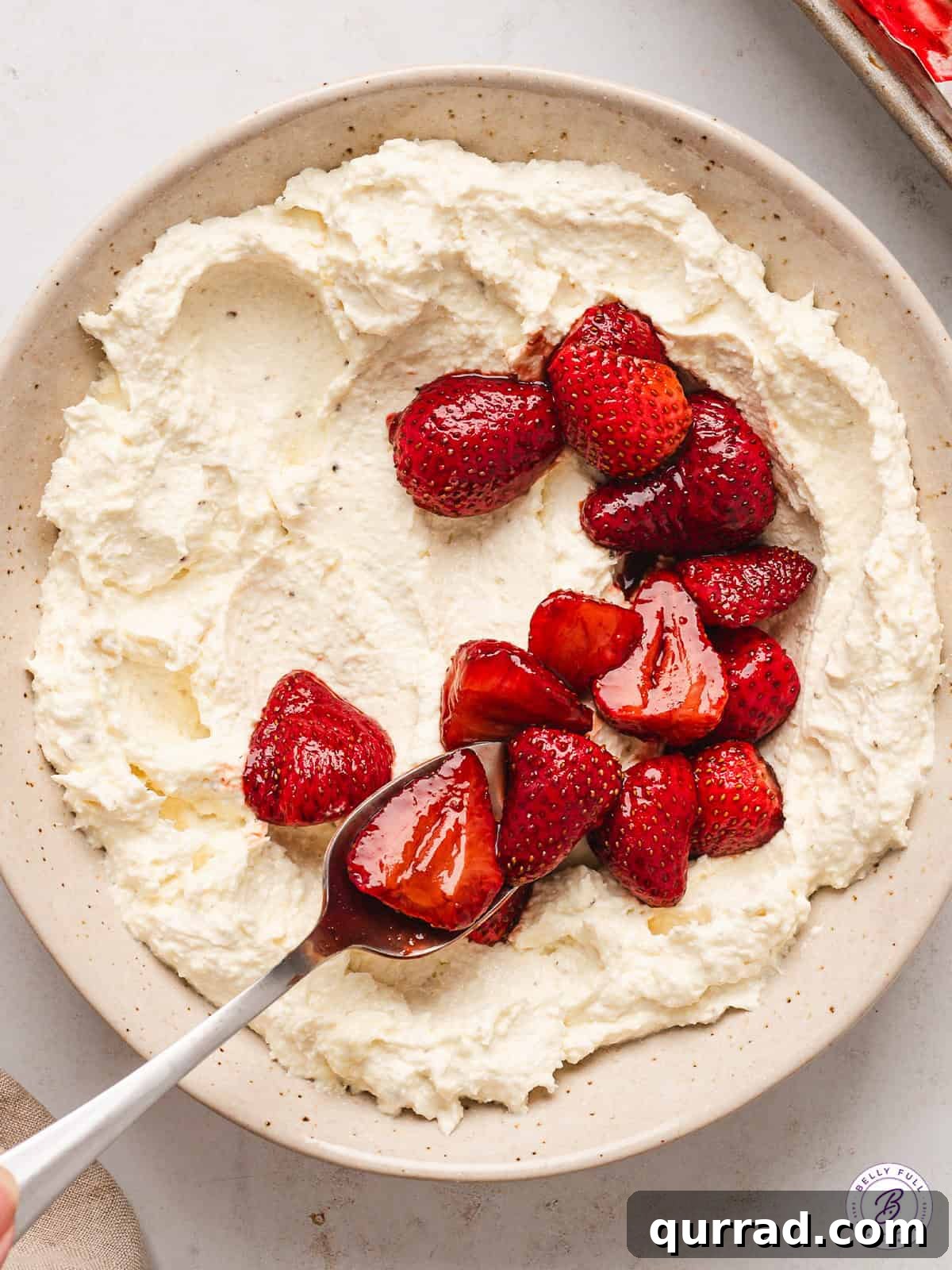 A bowl of whipped feta cheese dip with strawberries