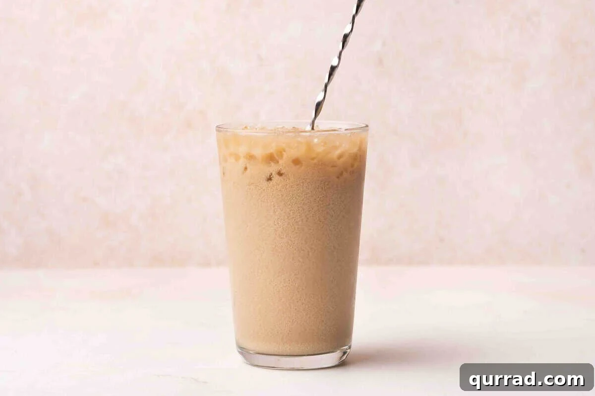 A dirty soda with a straw.