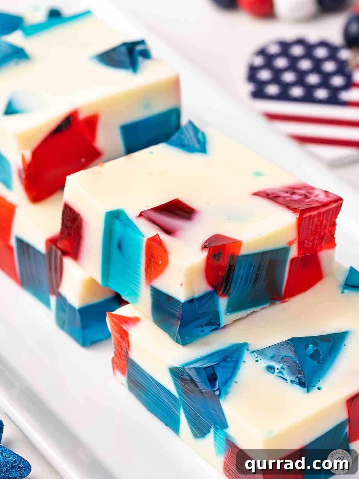 Patriotic Red, White and Blue Jello Recipe 2 Side view of slices of red white and blue jello.