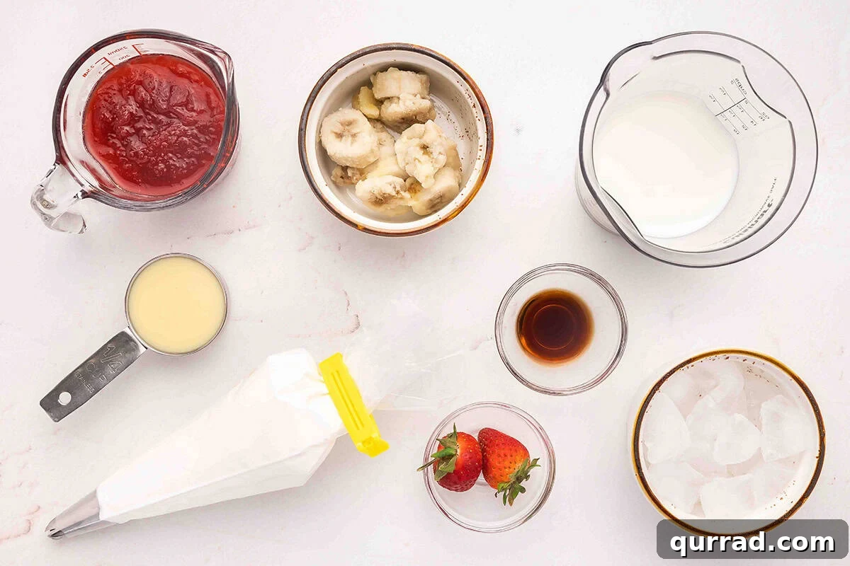 Creamy Strawberry Banana Orange Julius Smoothie 4 The ingredients to make a Strawberry Banana Orange Julius drink.