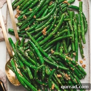 Garlic Green Beans Recipe: Sautéed with Lemon and Butter 3 Garlic green beans on a baking sheet.