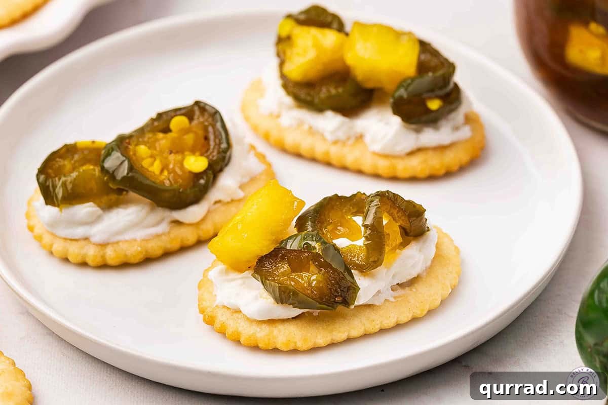 Cowgirl Candy Jalapeno Pepper Jelly Recipe 13 Cowgirl candy on a cracker with cream cheese.