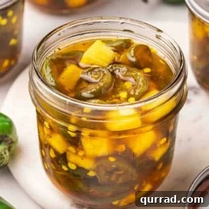 Cowgirl Candy Jalapeno Pepper Jelly Recipe 3 Overside sideview of an open jar of cowgirl candy.