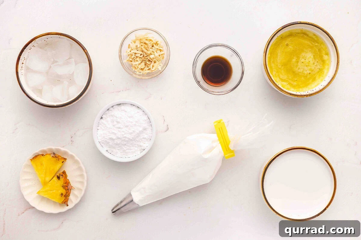 The ingredients to make a pineapple coconut orange julius drink.