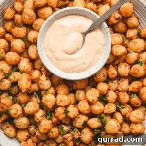 Bloomin onion bites on a plate with comeback sauce.