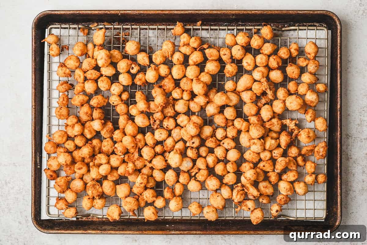 Bloomin onion bites on a baking sheet.
