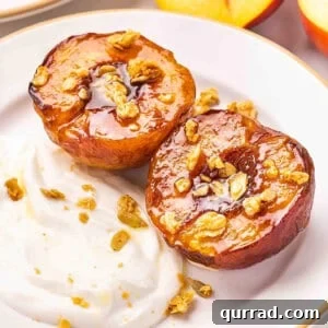 Air Fryer Peaches with Honey and Cinnamon 3 Air fryer peaches on a plate with yogurt and granola.