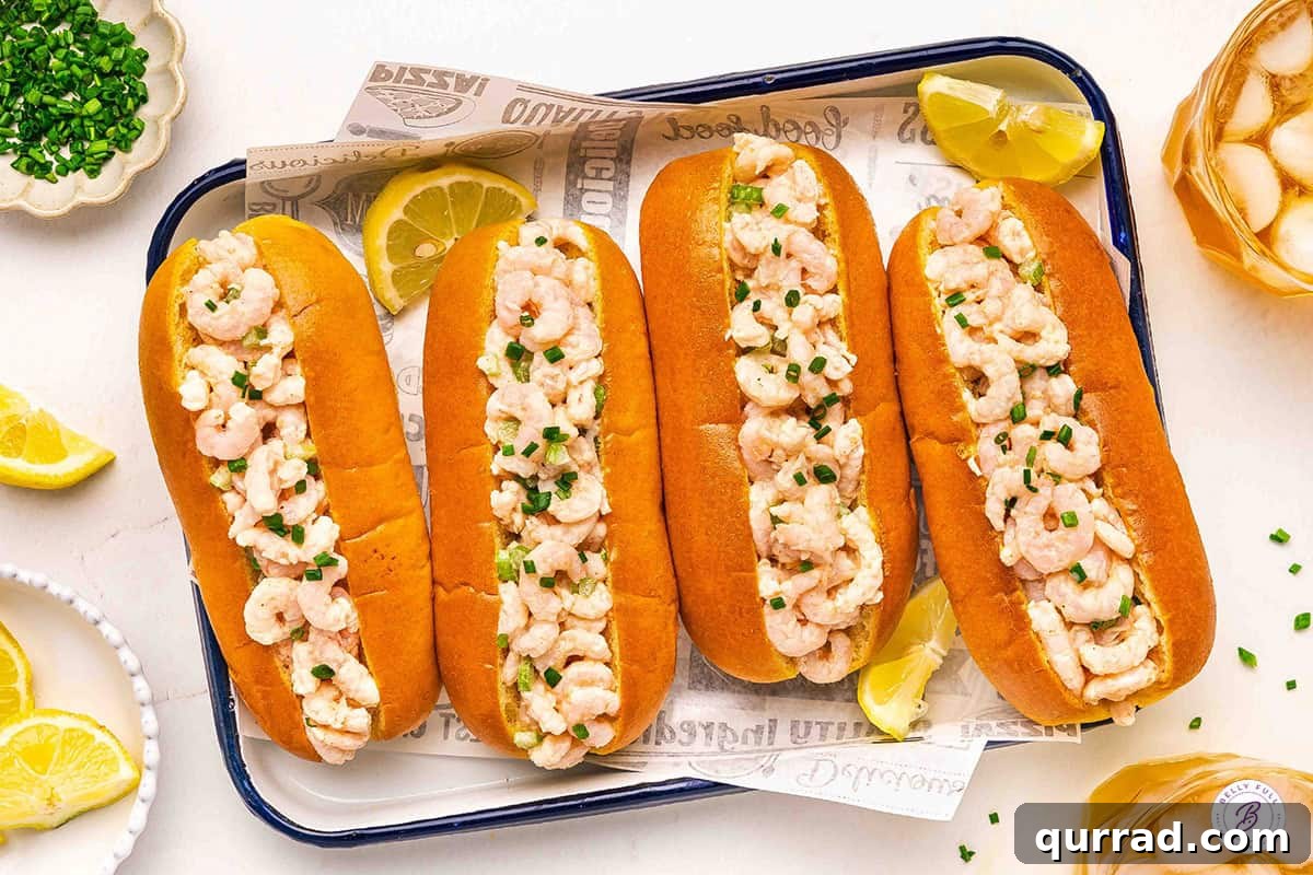 Overhead view of four homemade shrimp rolls.
