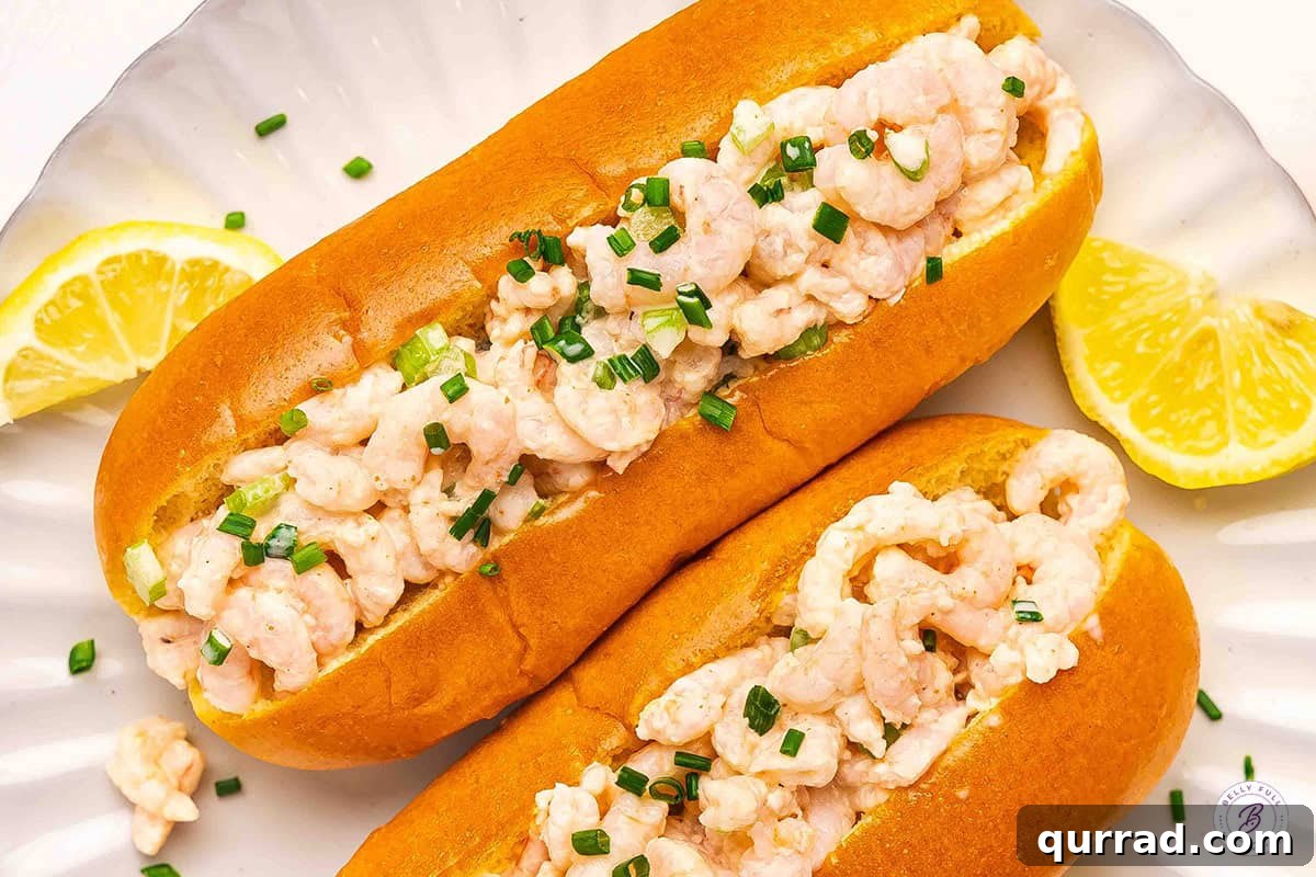 Overhead view of two shrimp rolls.