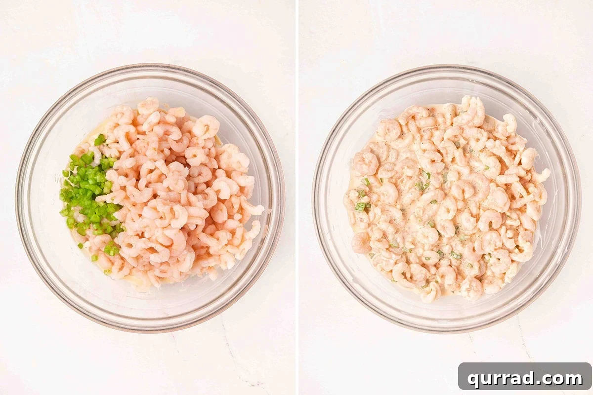 Small cooked shrimp and diced celery added to a bowl of mayo-based dressing.