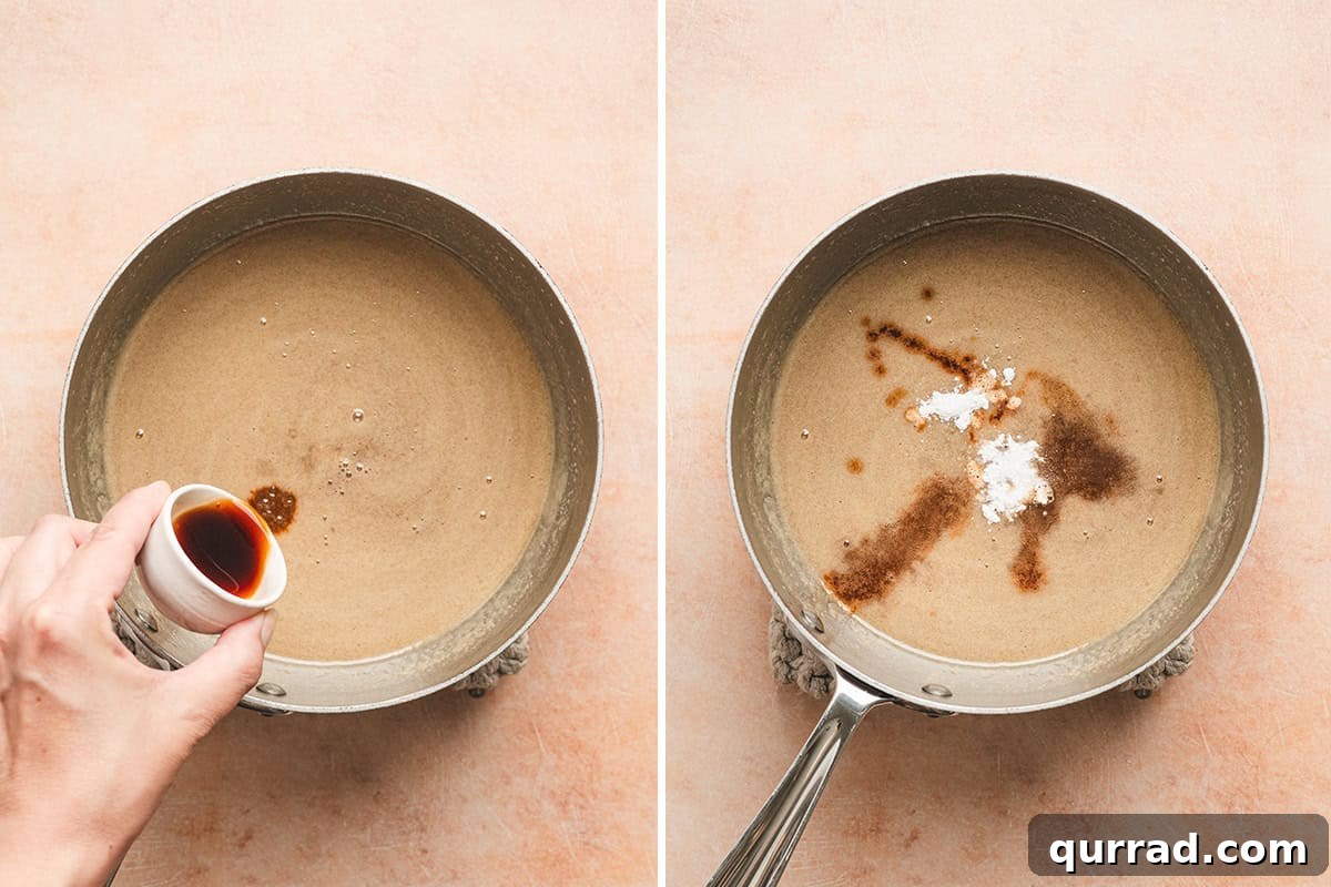 Vanilla extract being poured into maple butter syrup in a sauce pan, followed by baking soda and salt also added to the sauce pan.